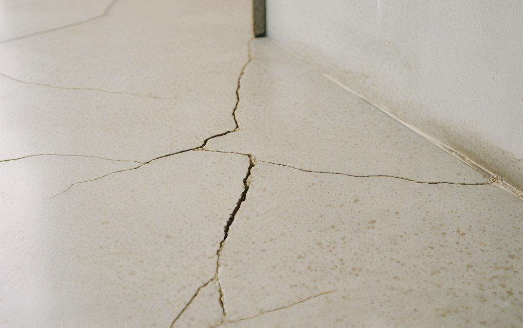 cracked concrete flooring in the home