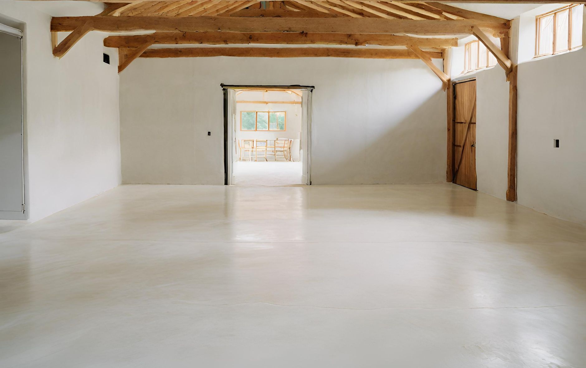 Concrete flooring which has had a liquid moisture barrier applied.