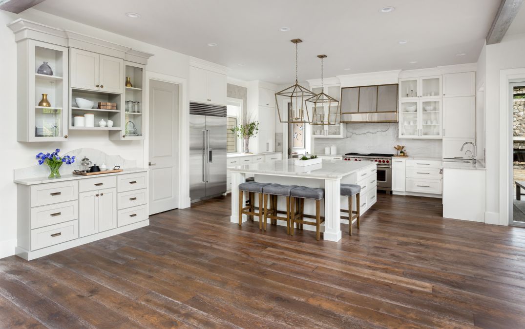 Dark stained hardwood flooring for a residential kitchen.
