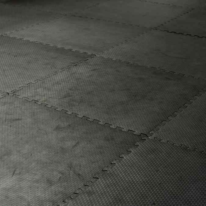 Black interlocking rubber tile flooring